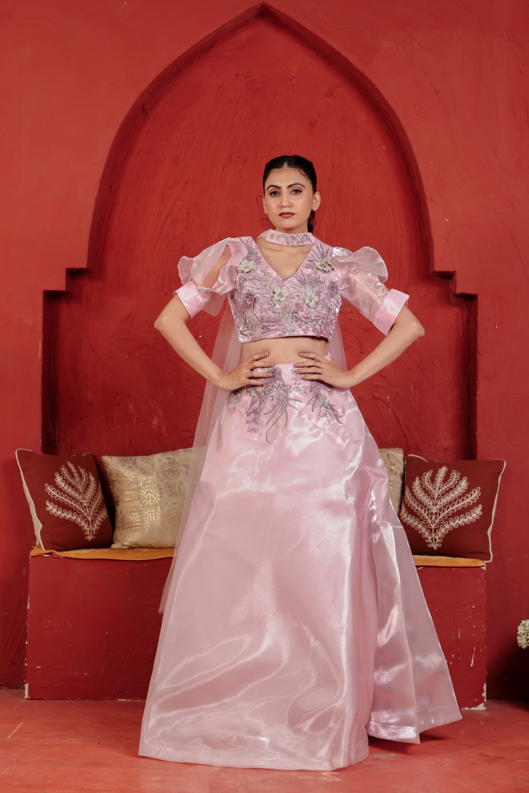 jimmy choo pink dress Princess-style gown, crafted from luxurious Jimmy Choo fabric in a soft, romantic blush pink that shimmers beautifully with every movement. The neckline is adorned with delicately draped fabric, creating a soft, cape-like